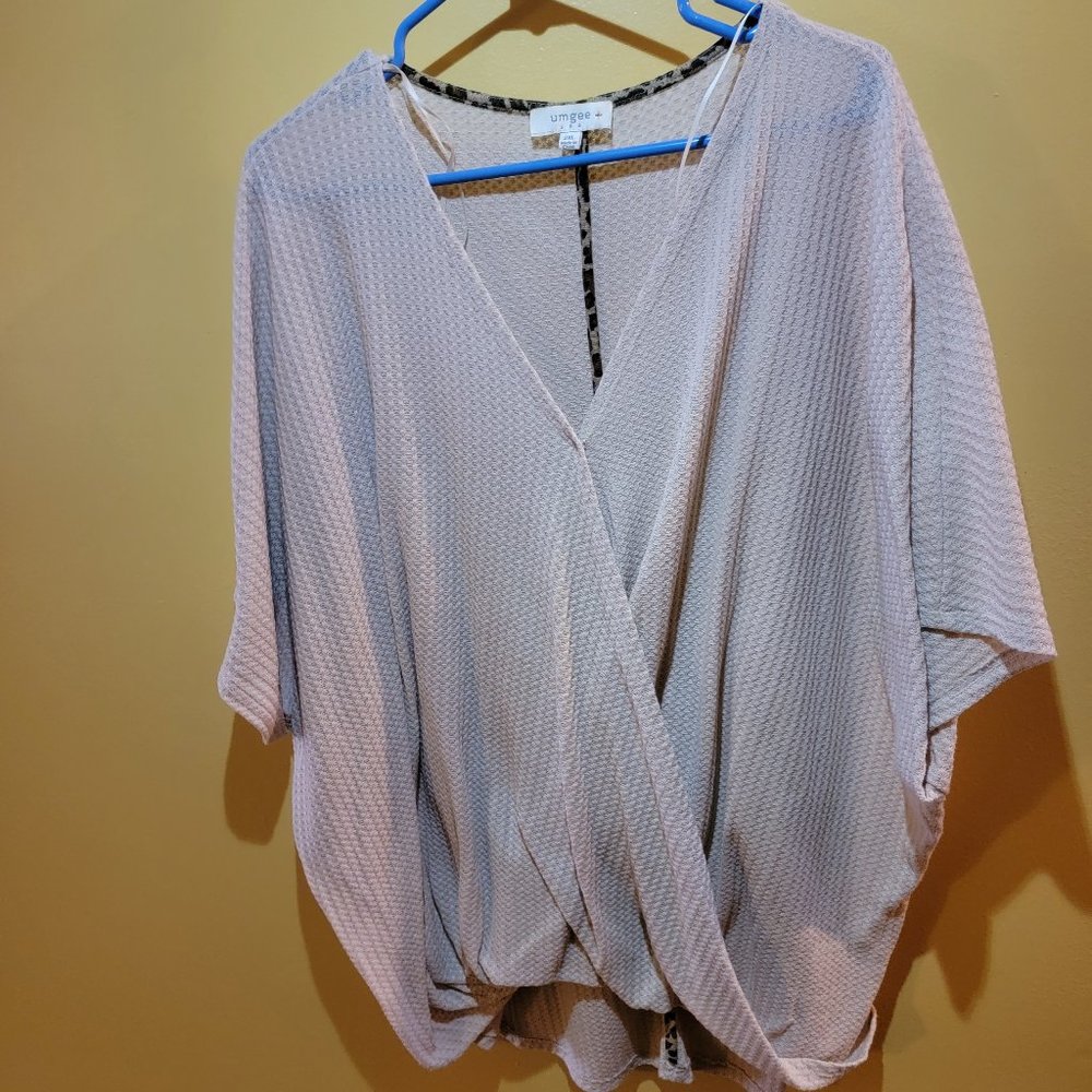 Cream crossove v neck pullover.